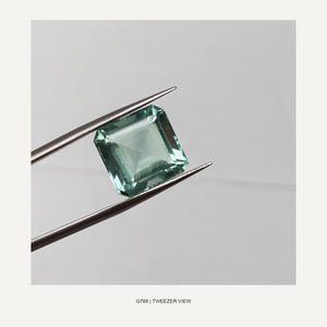 G768 FLUORITE EMERALD CUT 14.05CT - 02-G768-TWEEZER